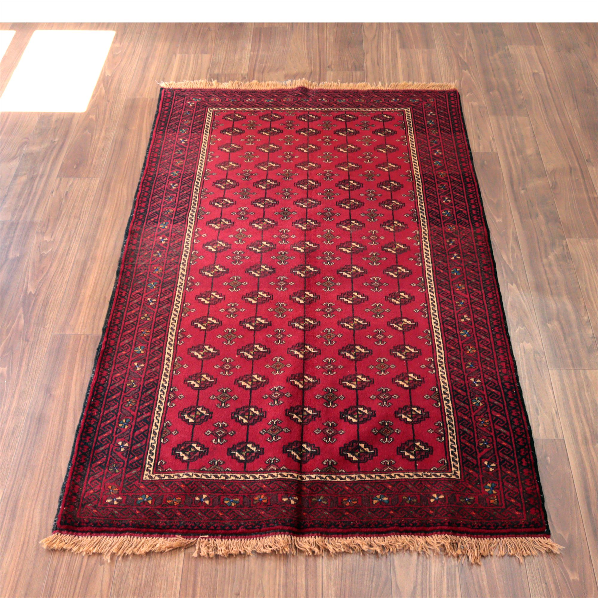 イランの手織りラグ バルーチ194×114cm 連続する幾何学模様