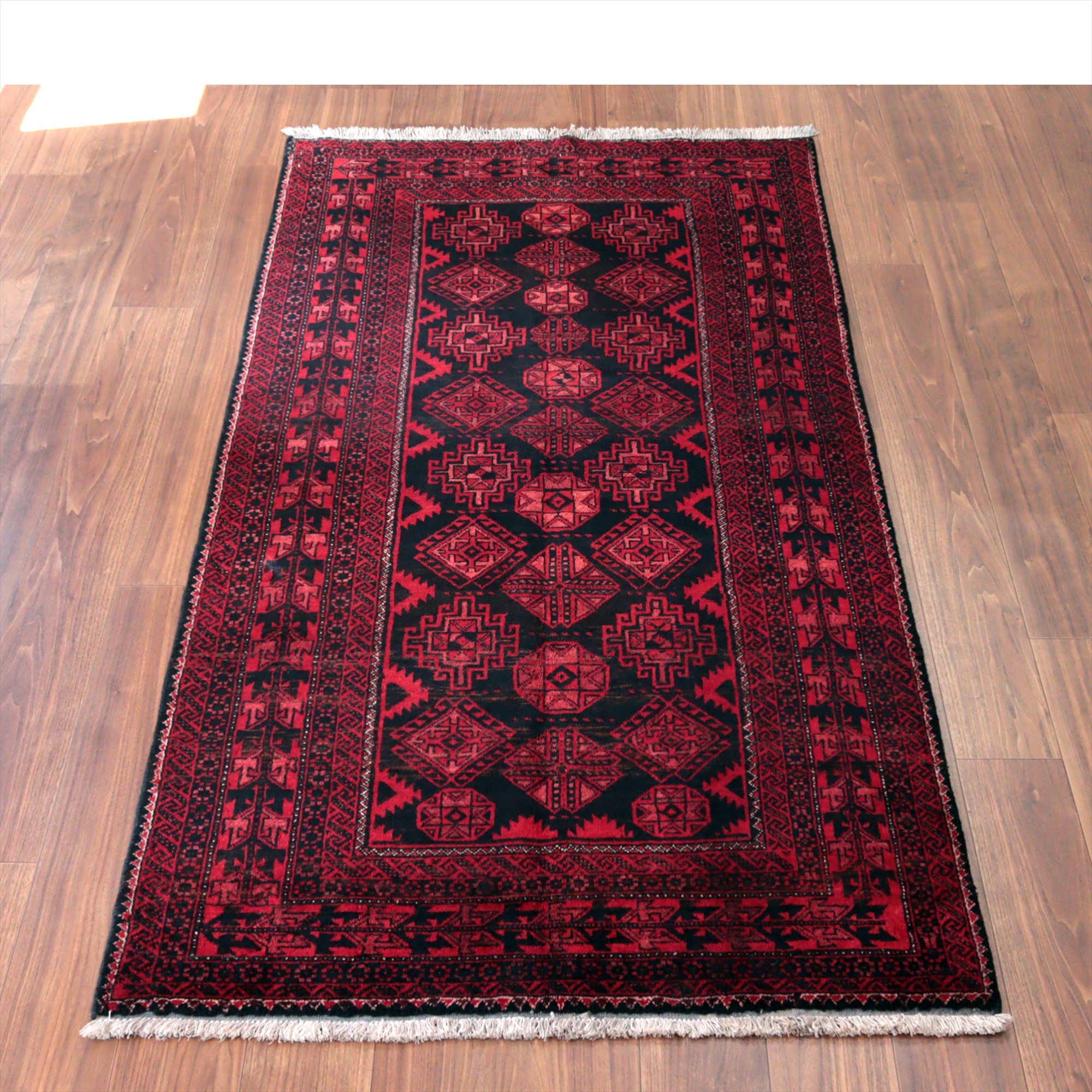 イランの手織りラグ バルーチ210×110cm 連なる幾何学模様 レッド